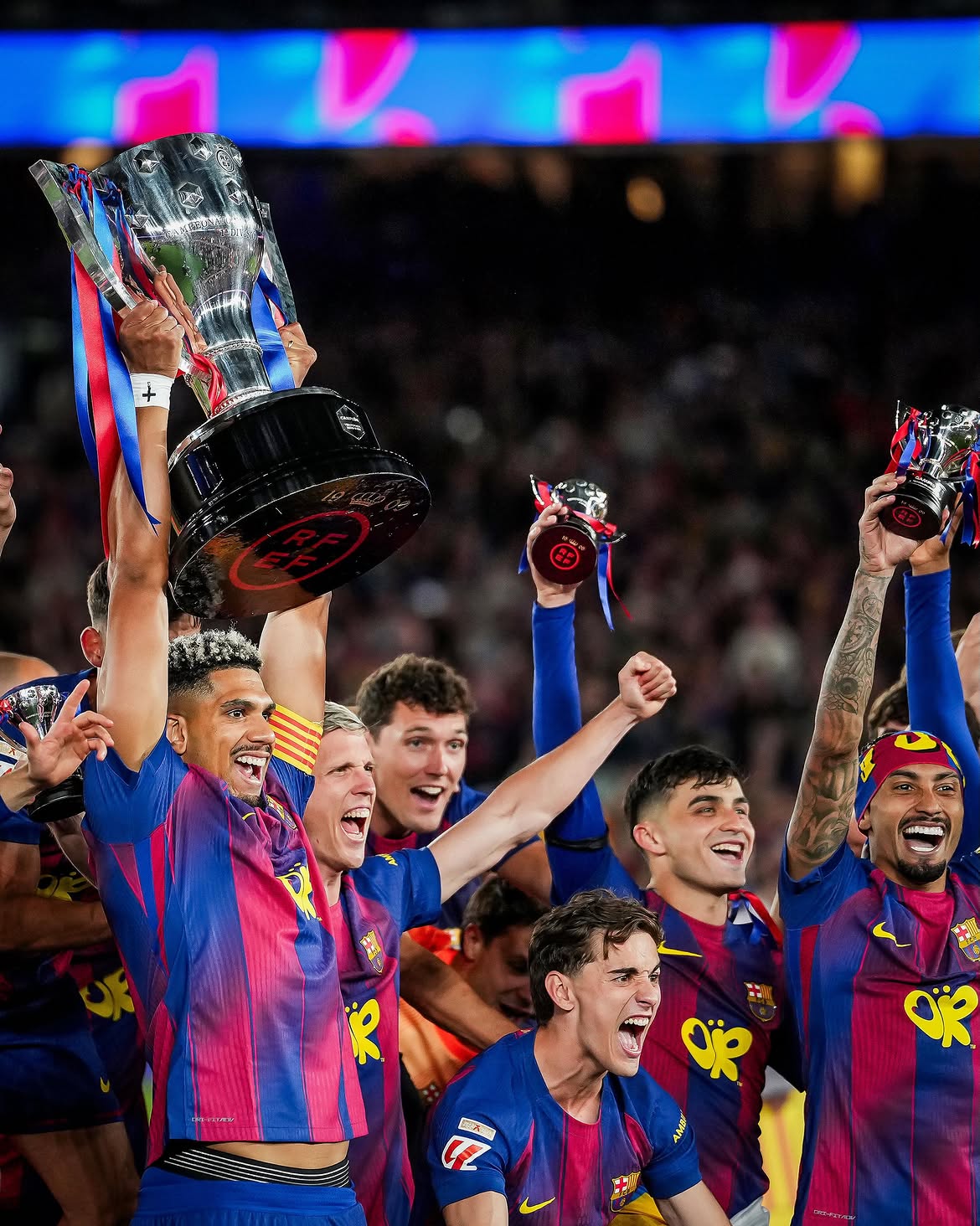 Players celebrating with a trophy